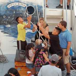 Sail tour participants on the deck of Tall Ship Windy