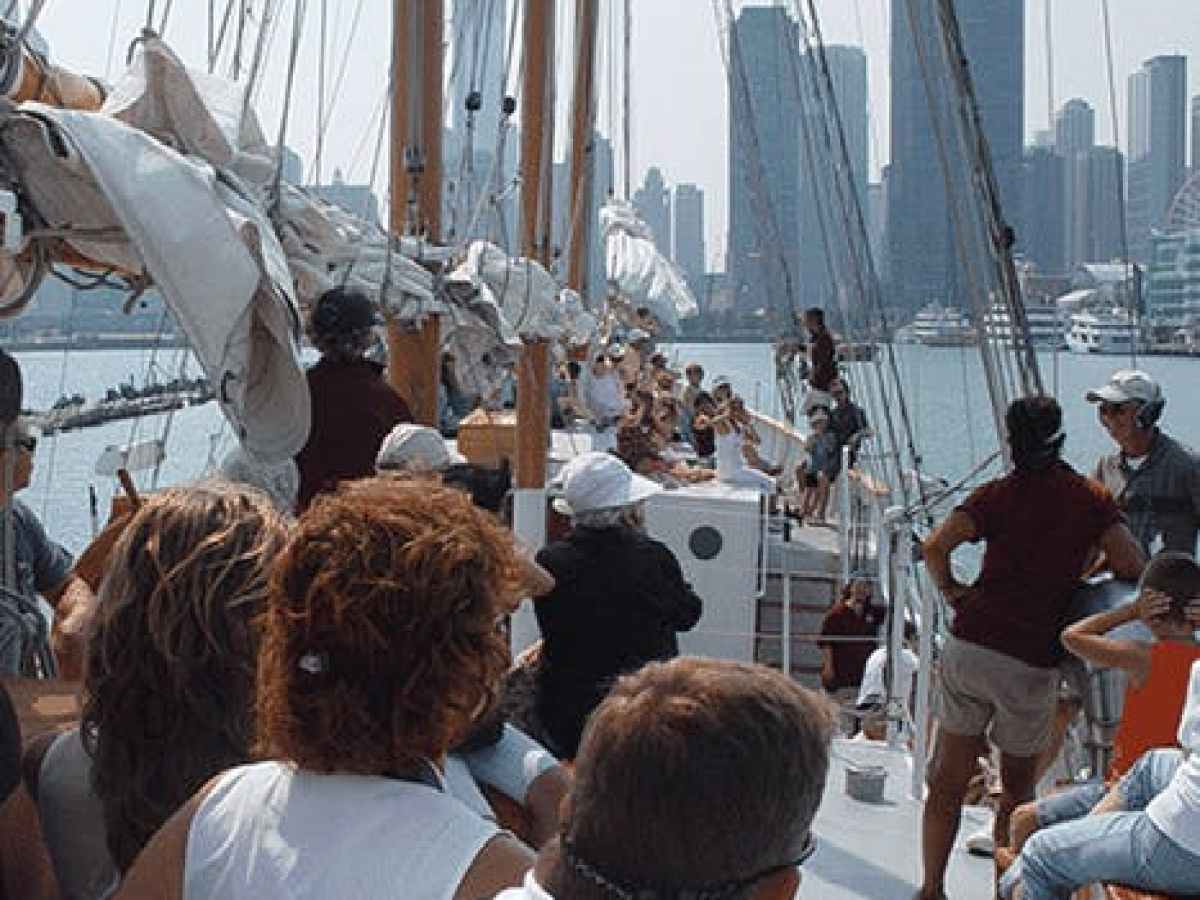 Sail tour participants on the deck of Tall Ship Windy