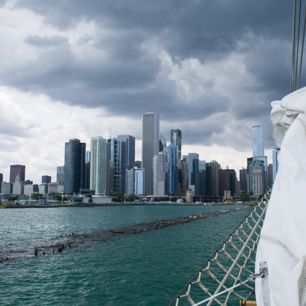 a body of water with a city in the background